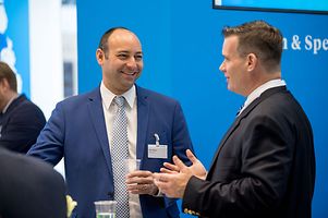 Washington Representative Omar Oweiss (left) in discussion with an interested visitor @ GTAI booth.